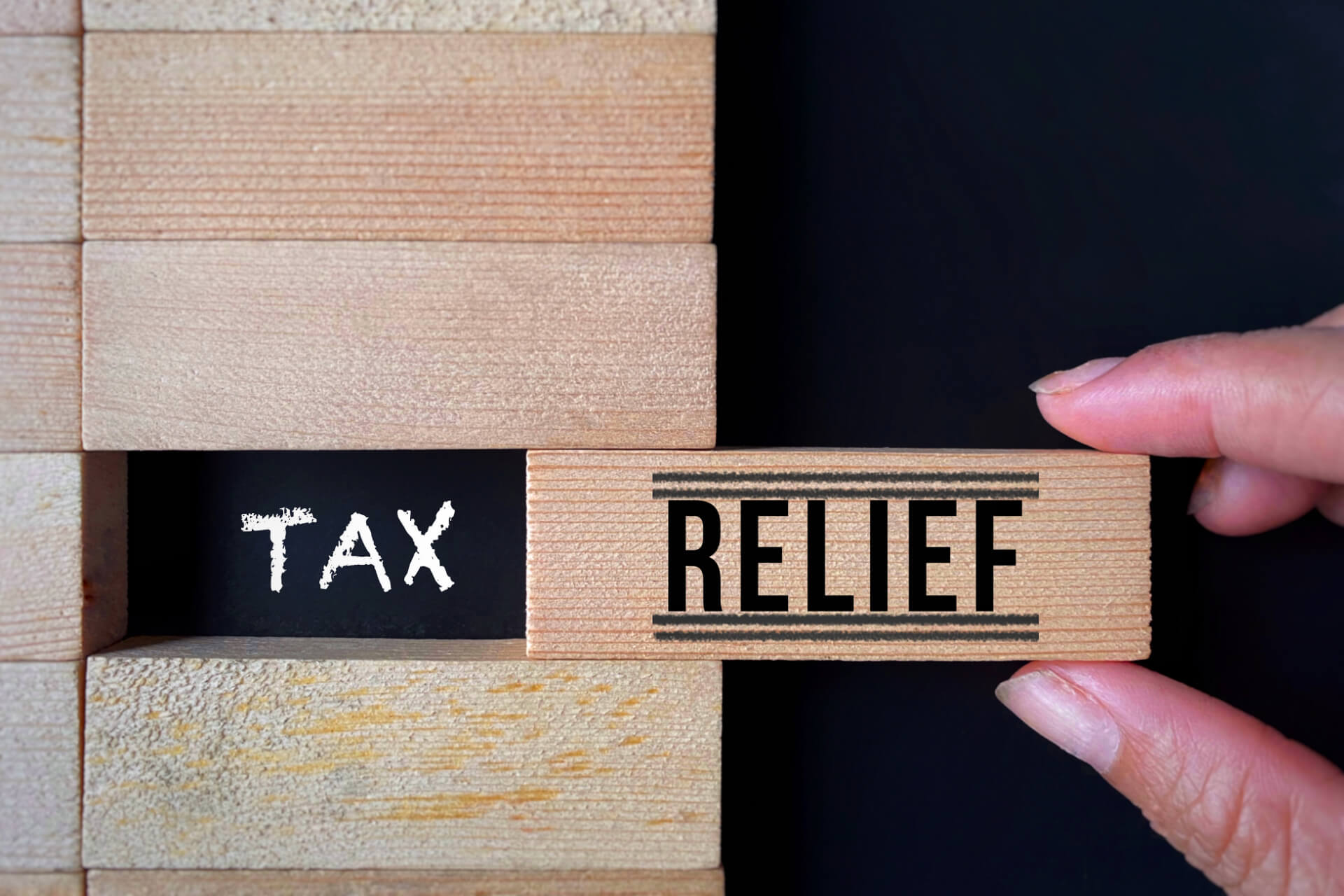 wooden blocks spelling tex relief